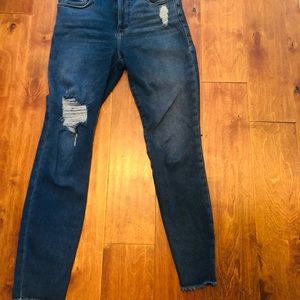 Bought too big. Worn twice. Crop, distress denim.